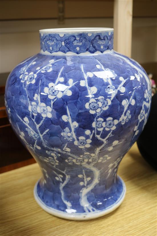 A 19th century Chinese large blue and white baluster vase decorated with prunus